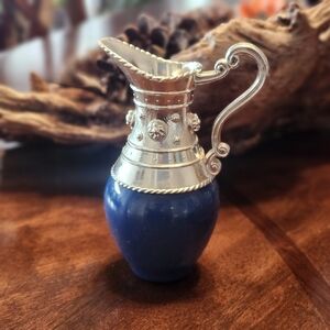 vintage 1973 Avon Venetian Pitcher cologne bottle in blue with a silver-tones